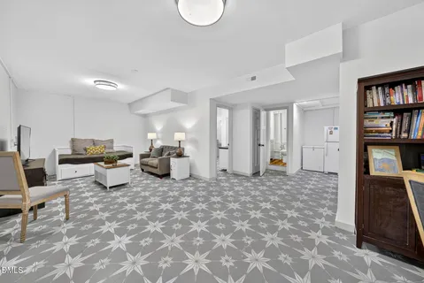 a large room with lots of furniture and clutter