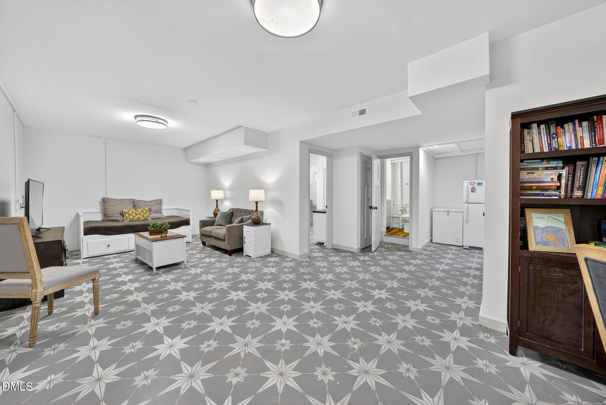 2808 Carpenter Pond Road Raleigh, NC 27613 - Photo 35 of 49 a large room with lots of furniture and clutter