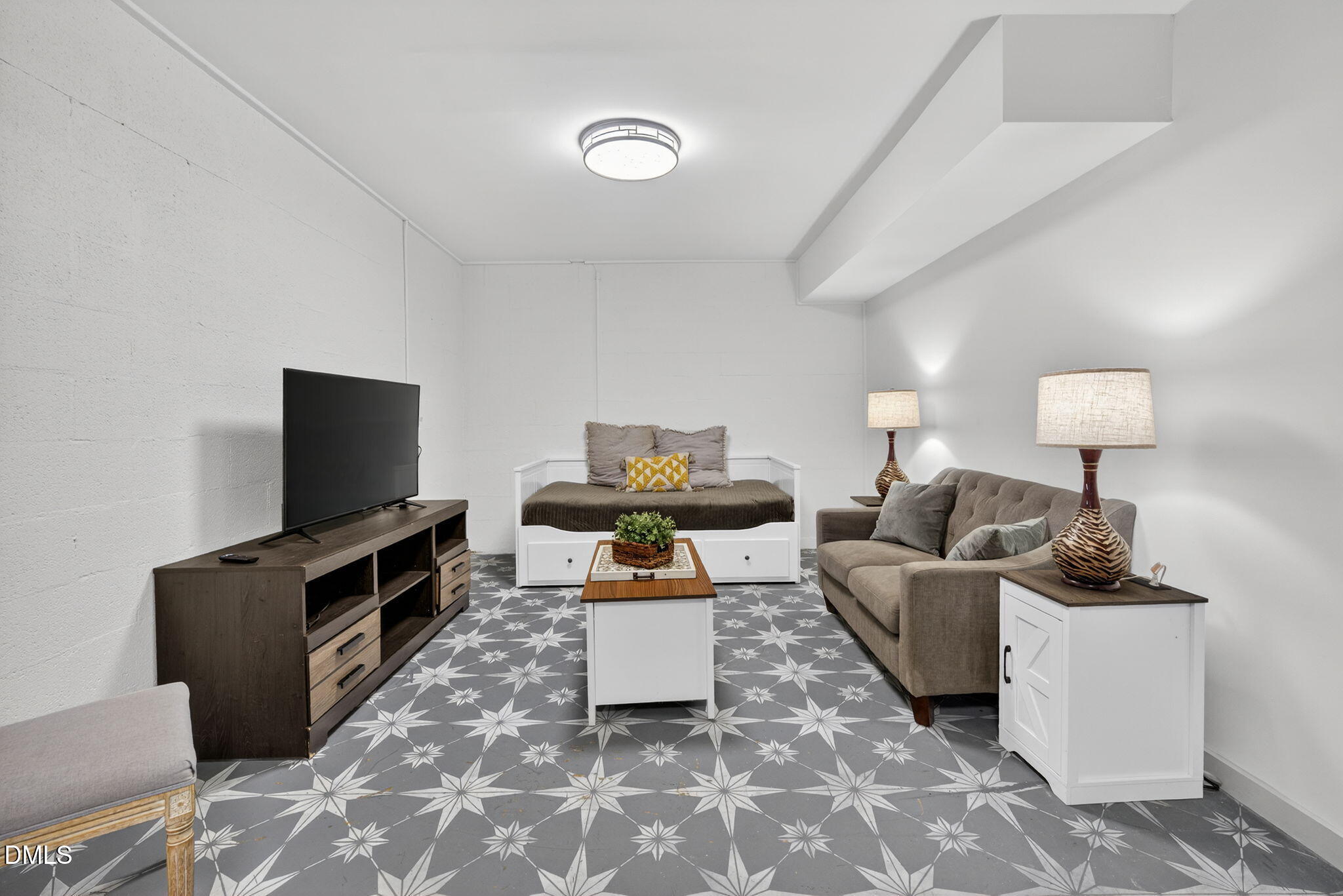 2808 Carpenter Pond Road Raleigh, NC 27613 - Photo 37 of 49 a living room with furniture a flat screen tv and a table