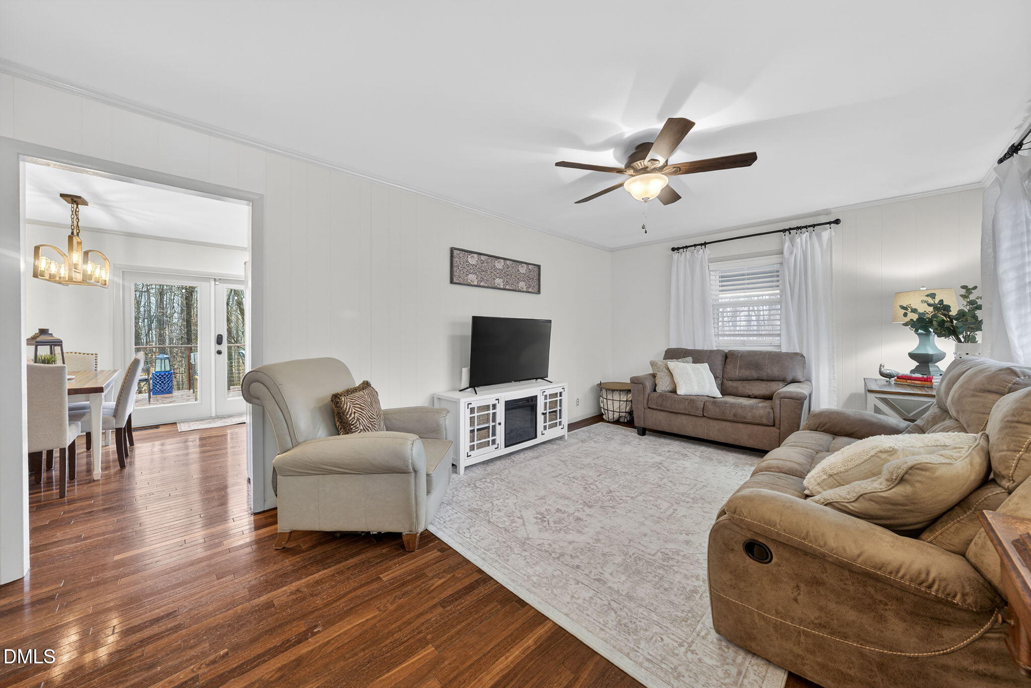 2808 Carpenter Pond Road Raleigh, NC 27613 - Photo 5 of 49 a living room with furniture and a flat screen tv