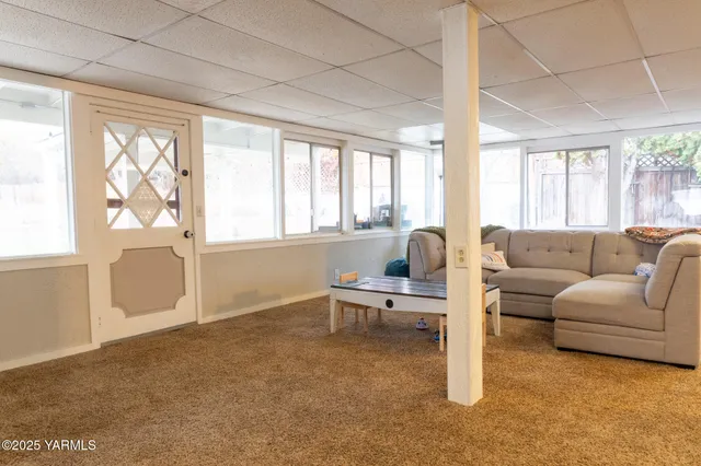 a living room with furniture and a table