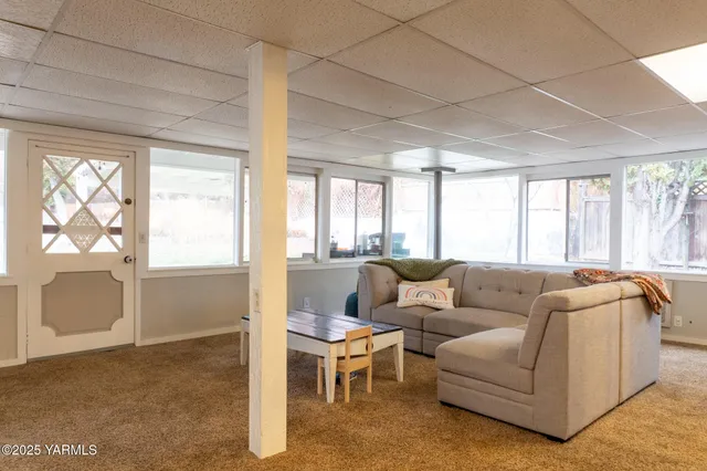 a living room with furniture and a table