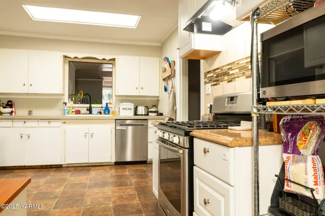 a bathroom with a tub and a window