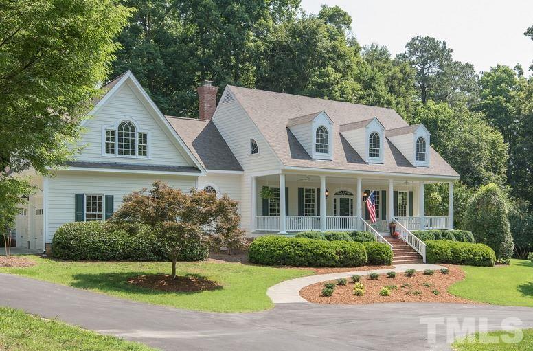 12016 Shooting Club Road Raleigh, NC 27613 - Photo 1 of 25 a front view of a house with a yard