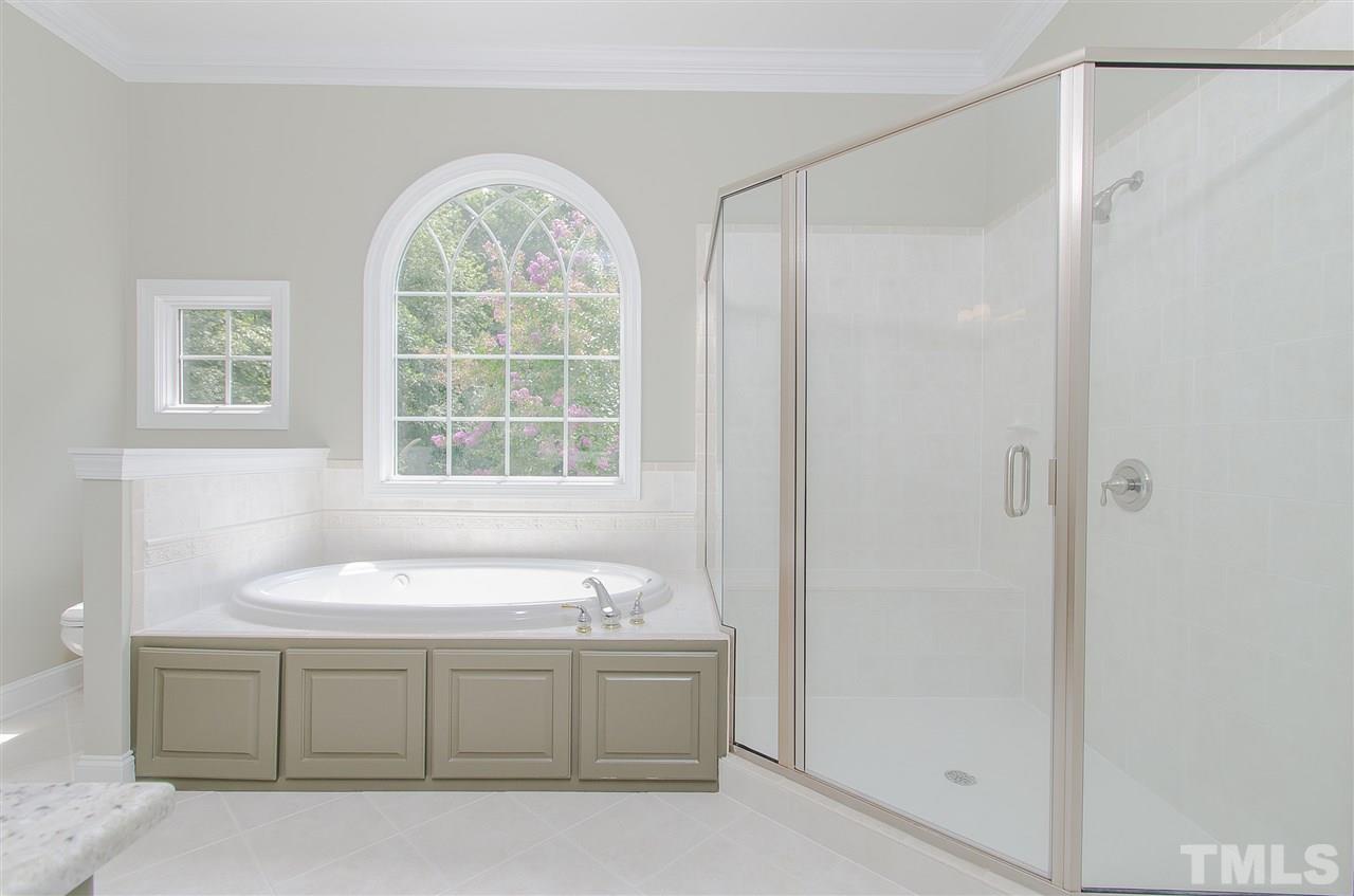 12016 Shooting Club Road Raleigh, NC 27613 - Photo 17 of 25 a bathroom with a sink and a window