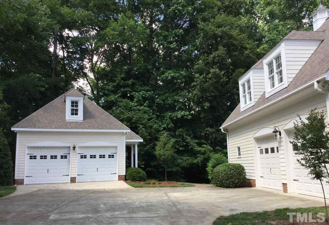 12016 Shooting Club Road Raleigh, NC 27613 - Photo 3 of 25 a front view of a house with a garden