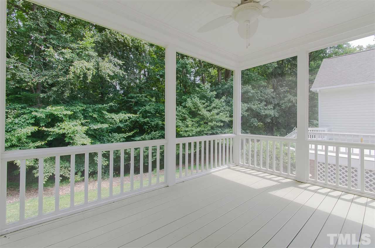 12016 Shooting Club Road Raleigh, NC 27613 - Photo 21 of 25 a balcony with wooden floor and outdoor space