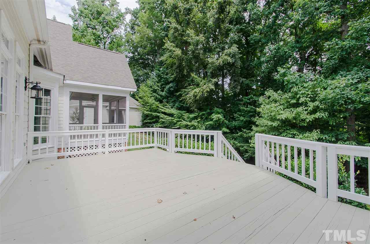 12016 Shooting Club Road Raleigh, NC 27613 - Photo 22 of 25 a view of a house with a deck