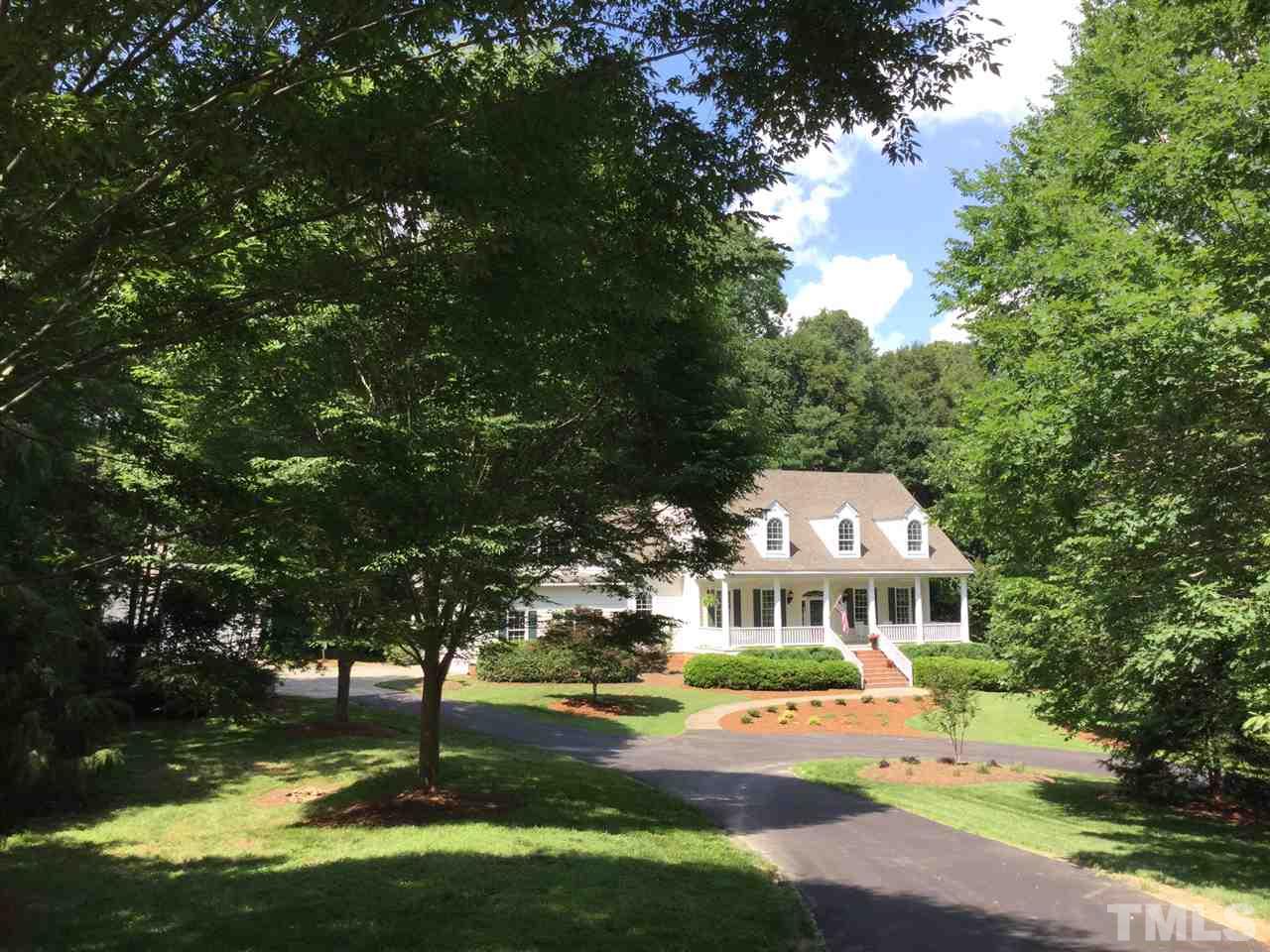 12016 Shooting Club Road Raleigh, NC 27613 - Photo 25 of 25 a front view of a house with a yard