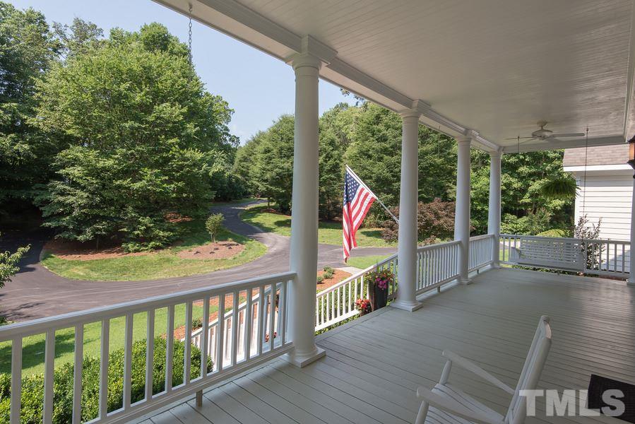 12016 Shooting Club Road Raleigh, NC 27613 - Photo 4 of 25 a view of a two chairs in the balcony