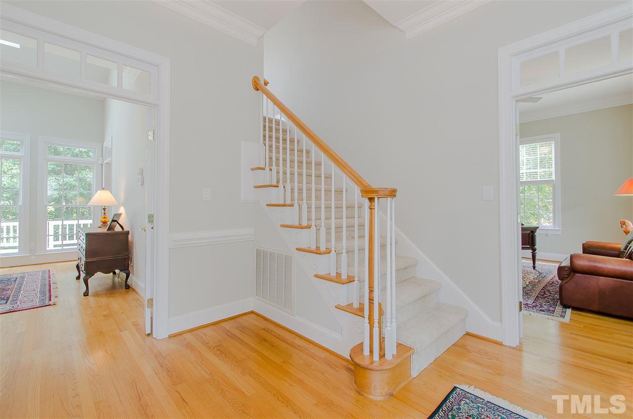 12016 Shooting Club Road Raleigh, NC 27613 - Photo 5 of 25 a view of entryway and hall with wooden floor