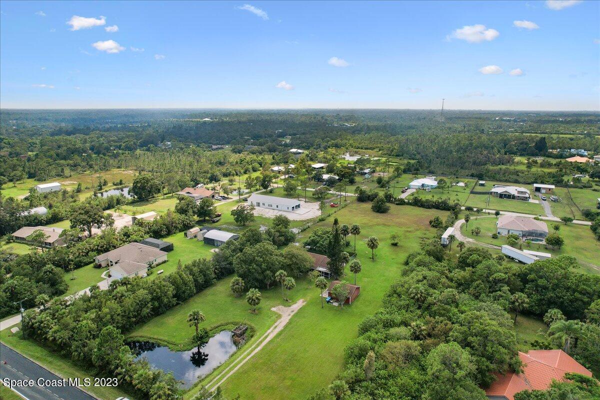 2660 Weber Road Malabar, FL 32950 - Photo 68 of 74 an aerial view of residential houses with outdoor space and trees