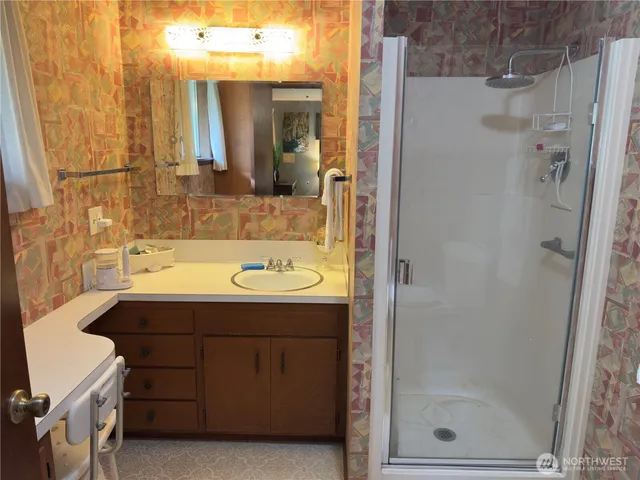 a bathroom with a sink and mirror