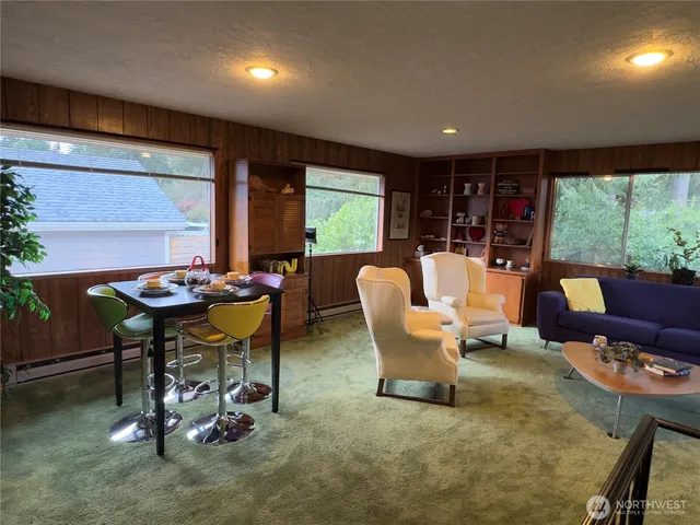 a view of a dining room with furniture window and outside view