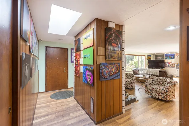 a view of water heater room with furniture and rug floor