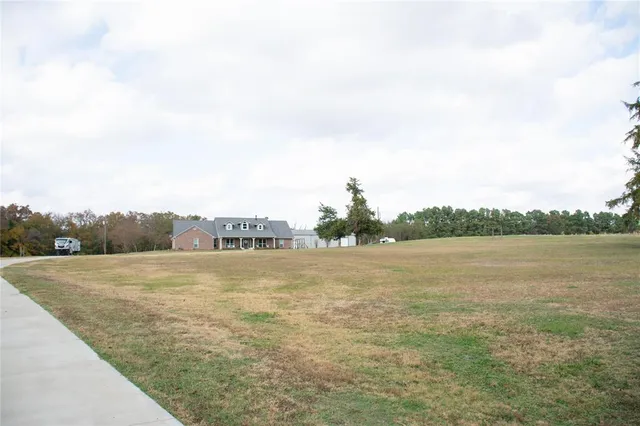 a view of ocean with green space