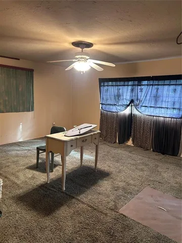 a view of a livingroom with furniture