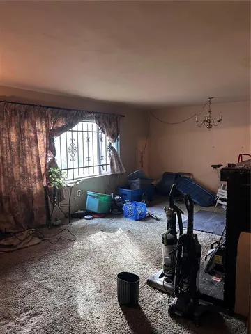 a room with furniture and a window