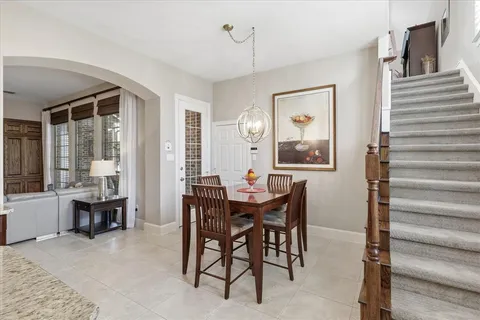 a view of a dining room with furniture and window