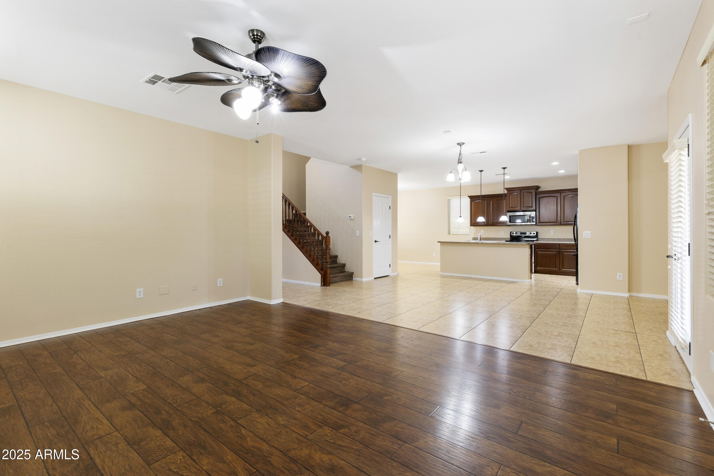 1870 South Colt Drive Gilbert, AZ 85295 - Photo 15 of 42 a view of a kitchen with a refrigerator and a stove top oven