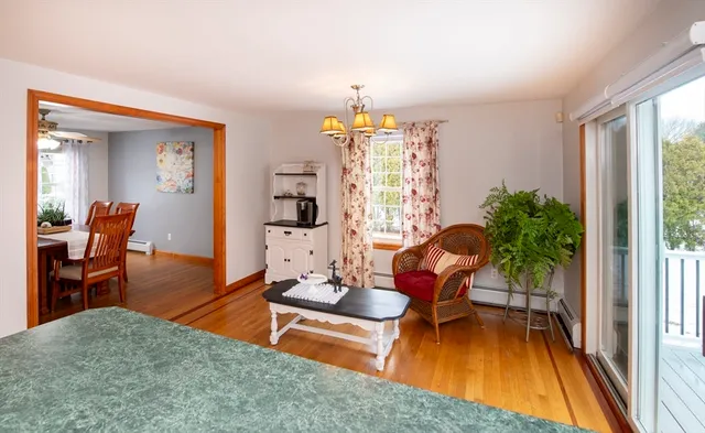 a living room with furniture a window and a dining table