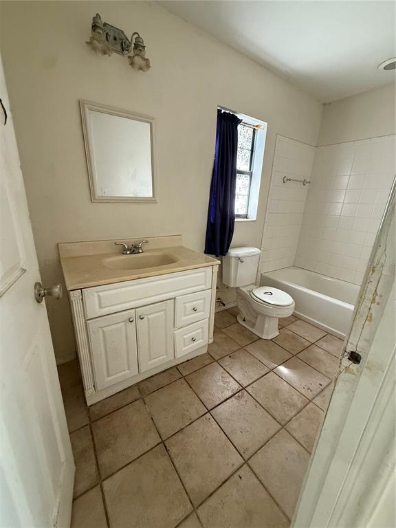 40907 West 3rd Avenue Umatilla, FL 32784 - Photo 11 of 13 a bathroom with a sink a toilet and mirror