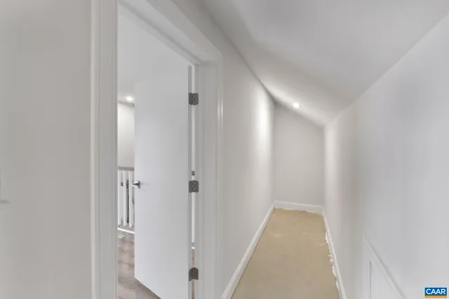 a view of a room with a white door