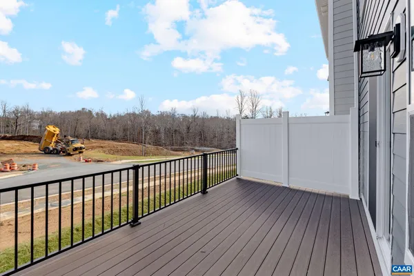 a view of a balcony with wooden fence
