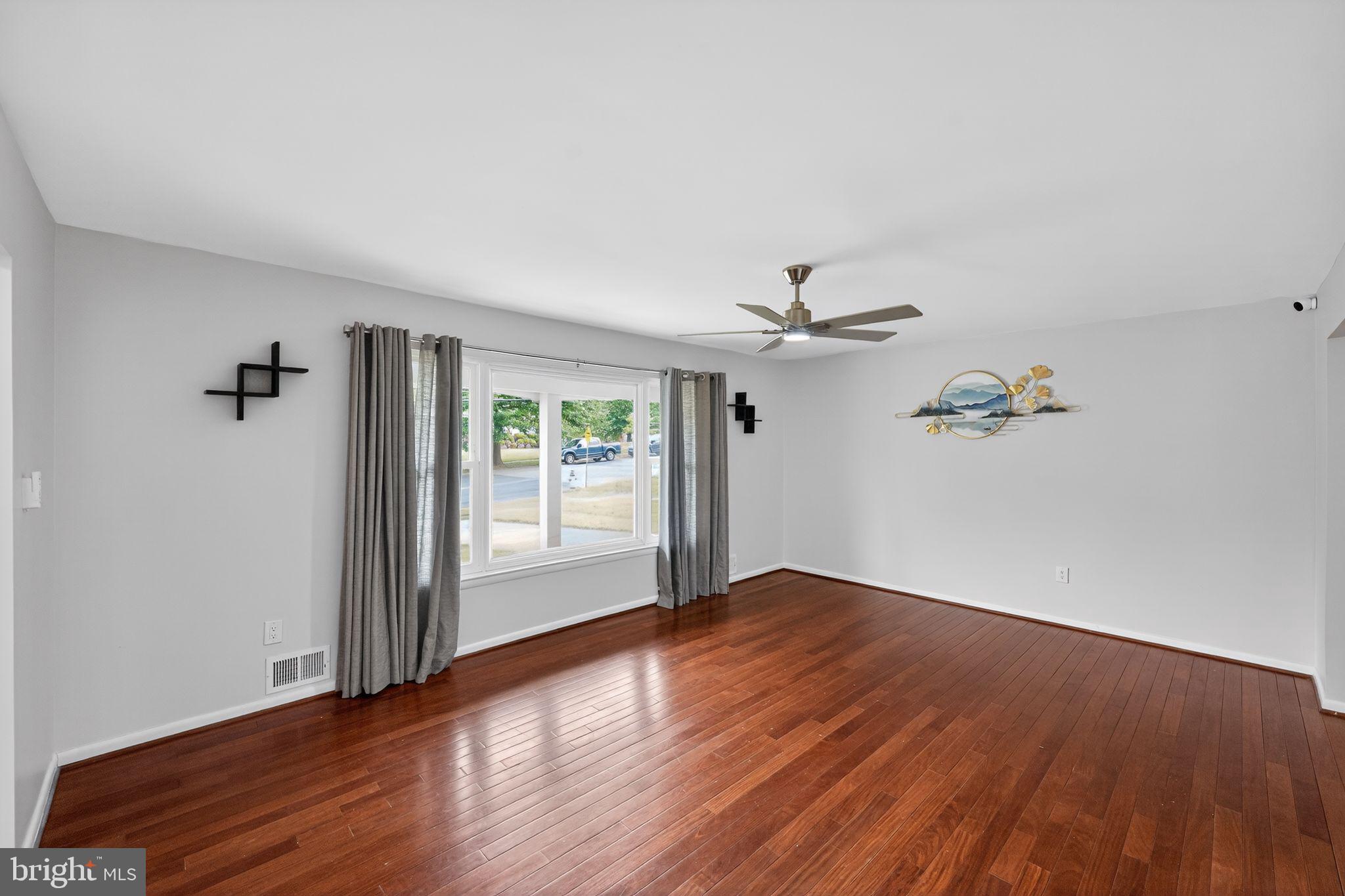13312 Fort Washington Road Fort Washington, MD 20744 - Photo 15 of 34 wooden floor in an empty room with a window