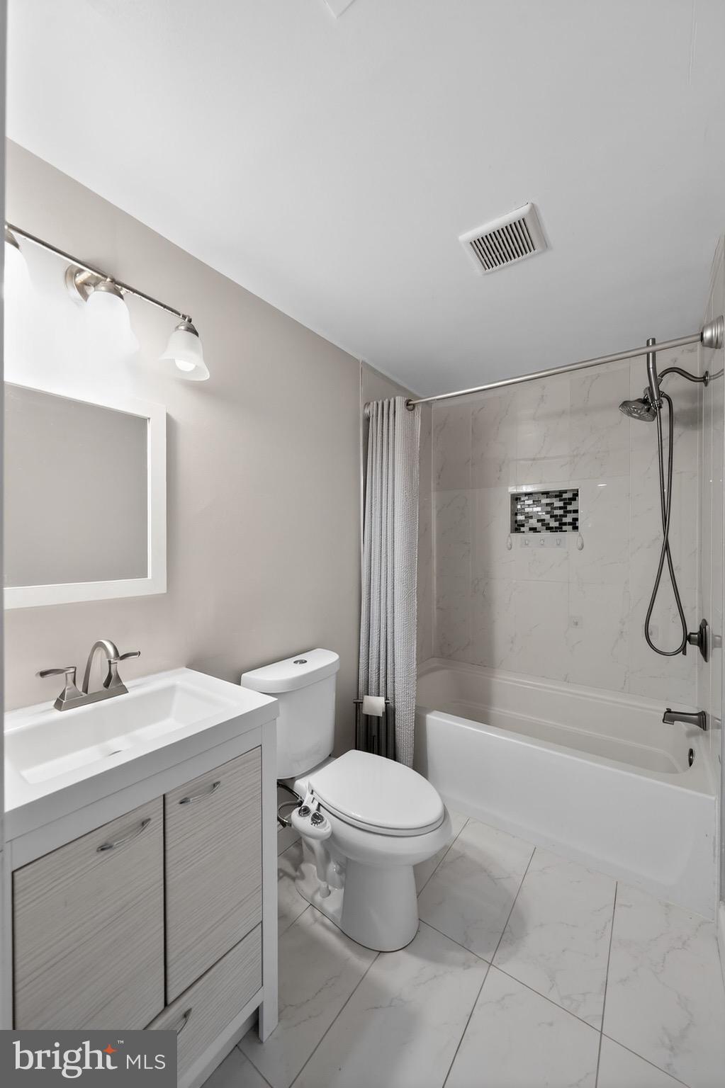 13312 Fort Washington Road Fort Washington, MD 20744 - Photo 23 of 34 a bathroom with a sink a toilet and shower