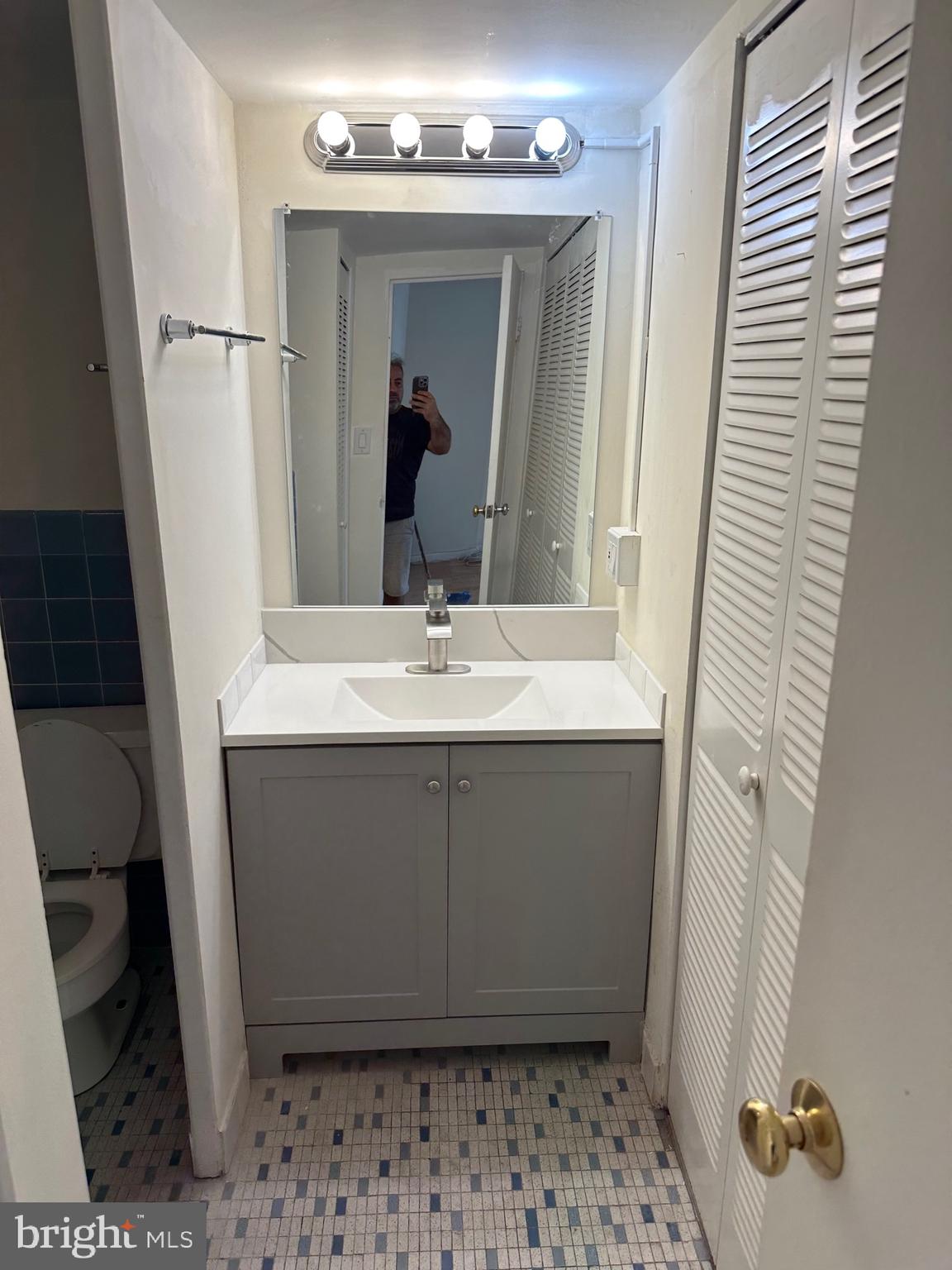 922 24th Street Northwest, Unit 608 Washington, DC 20037 - Photo 13 of 13 a bathroom with a sink and a mirror