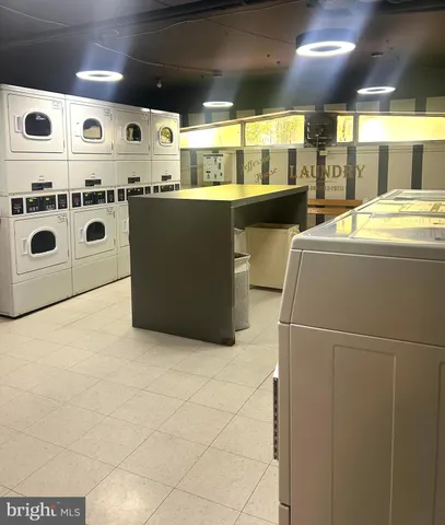 a kitchen with stainless steel appliances a stove a sink and a refrigerator