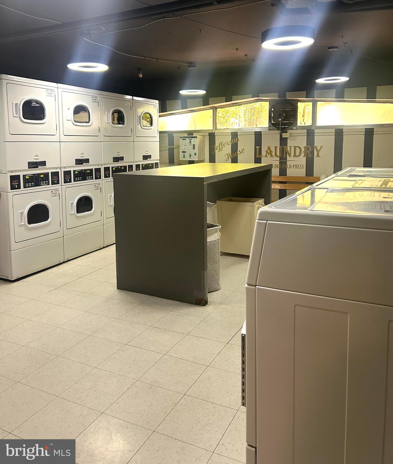 922 24th Street Northwest, Unit 608 Washington, DC 20037 - Photo 10 of 13 a kitchen with stainless steel appliances a stove a sink and a refrigerator