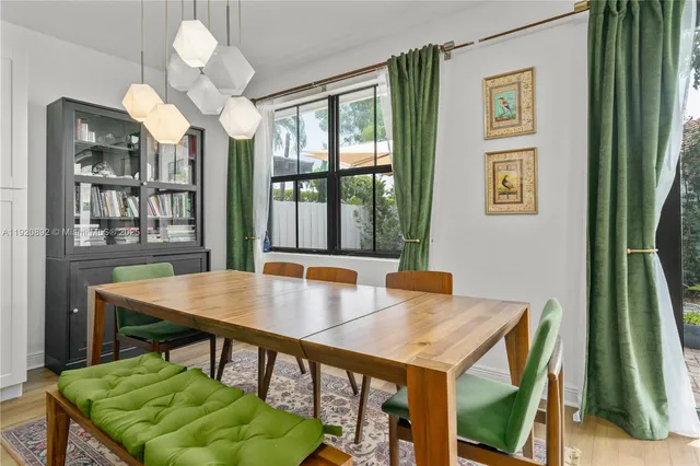 a view of a dining room with furniture window and outside view