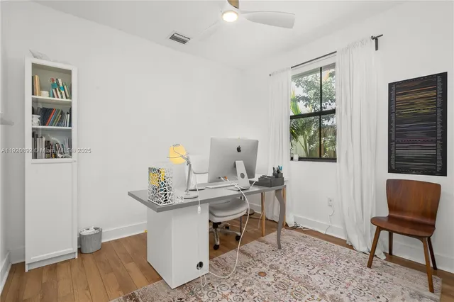 a view of dining room and wooden floor