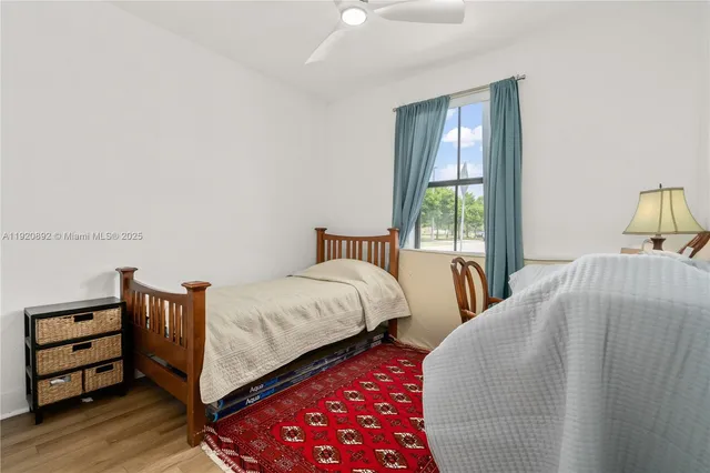 a bedroom with a bed and a table