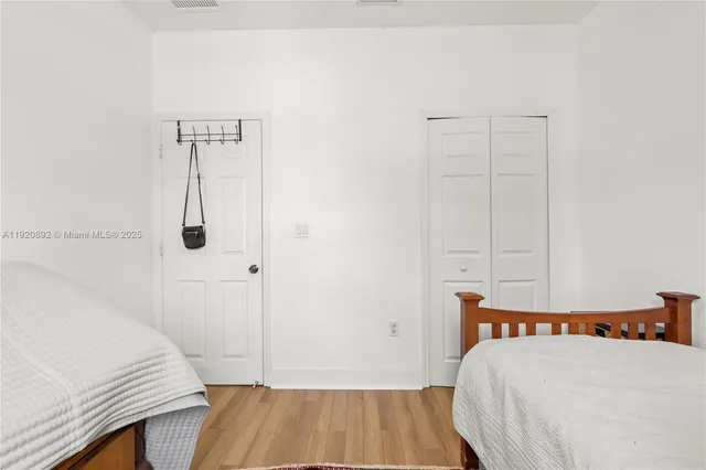 a view of house with a yard and swimming pool