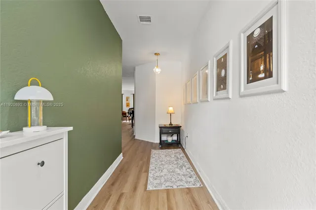 a view of a bedroom with a workspace