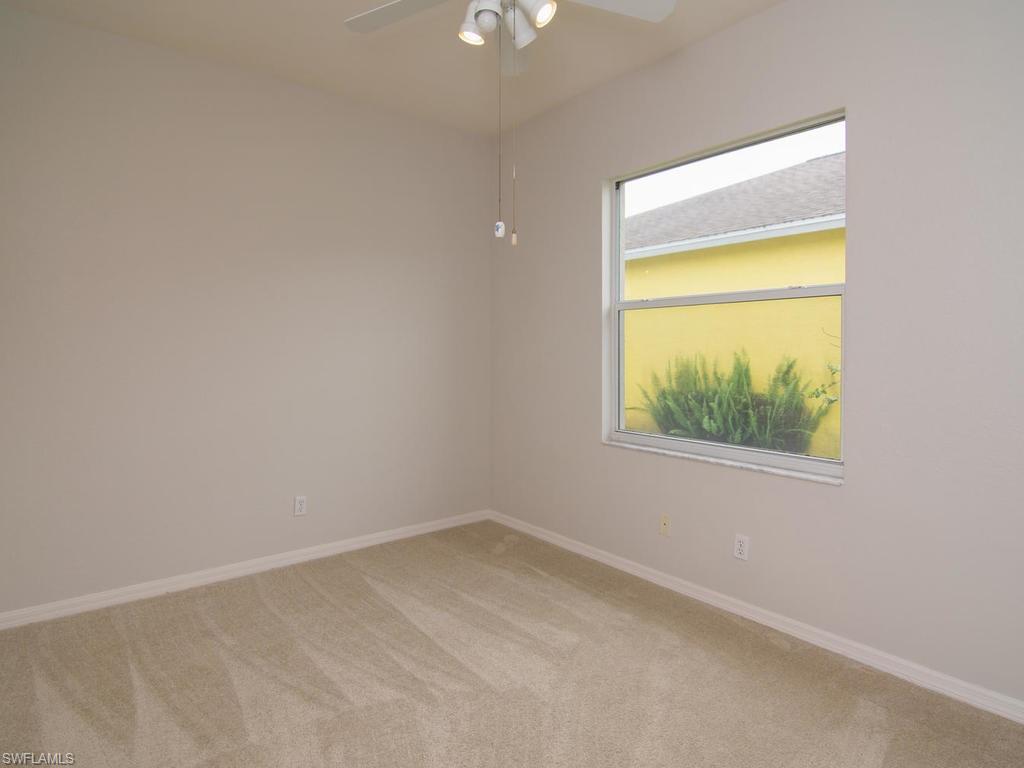 718 Crossfield Circle Naples, FL 34104 - Photo 11 of 17 an empty room with a window