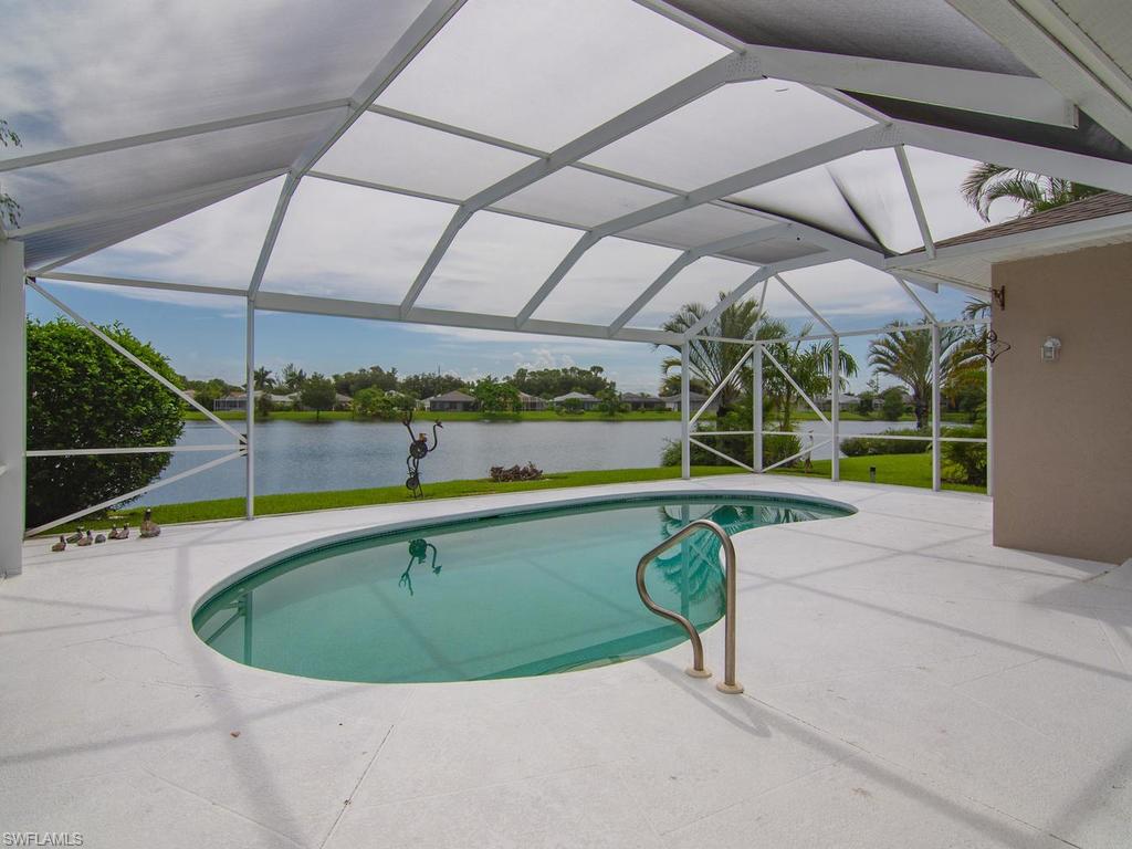 718 Crossfield Circle Naples, FL 34104 - Photo 15 of 17 a view of a tennis ground with a park