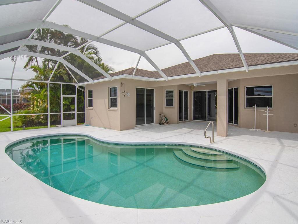 718 Crossfield Circle Naples, FL 34104 - Photo 17 of 17 a view of a house with a swimming pool