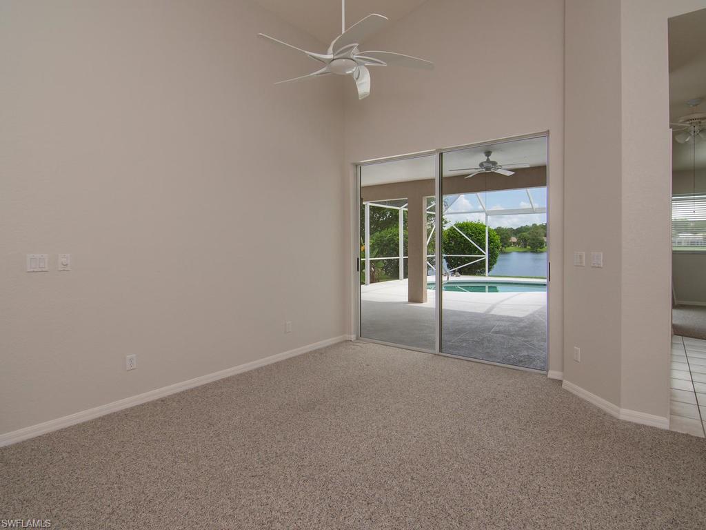 718 Crossfield Circle Naples, FL 34104 - Photo 3 of 17 an empty room and windows