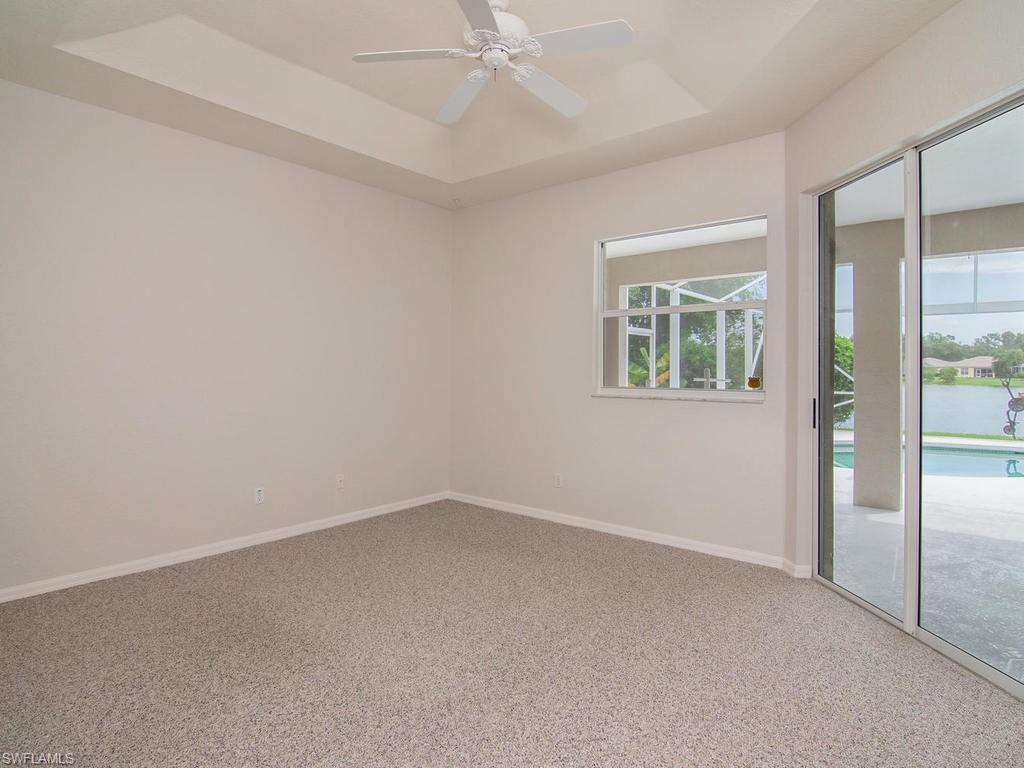 718 Crossfield Circle Naples, FL 34104 - Photo 9 of 17 an empty room with a window
