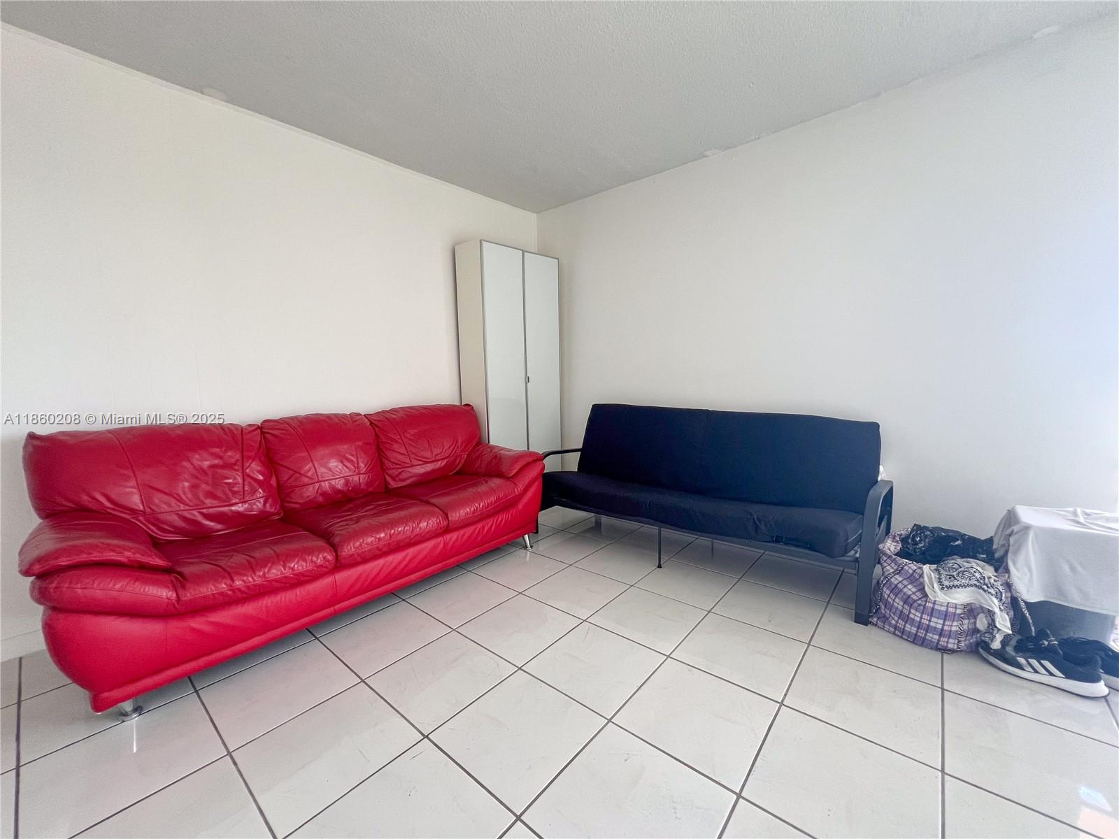 2200 East Hallandale Beach Boulevard, Unit 603 Hallandale Beach, FL 33009 - Photo 11 of 17 a living room with furniture