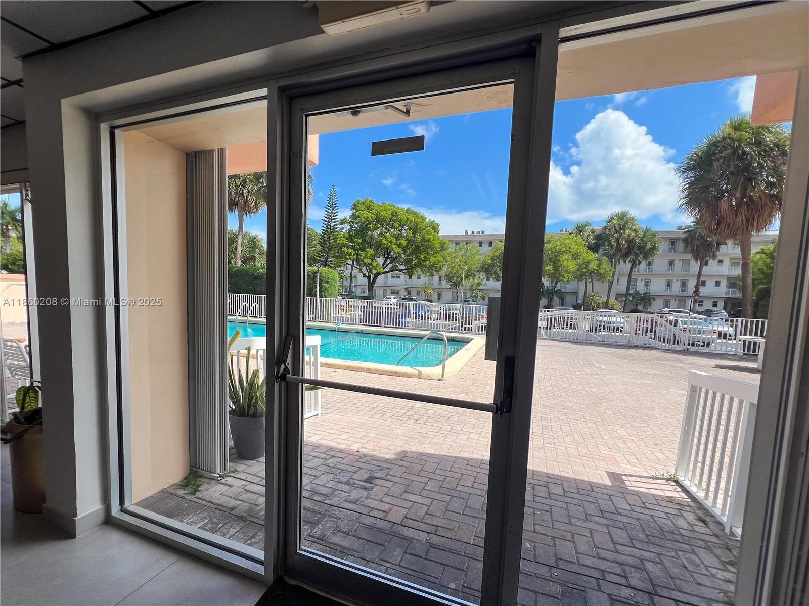 2200 East Hallandale Beach Boulevard, Unit 603 Hallandale Beach, FL 33009 - Photo 12 of 17 a view of backyard from door