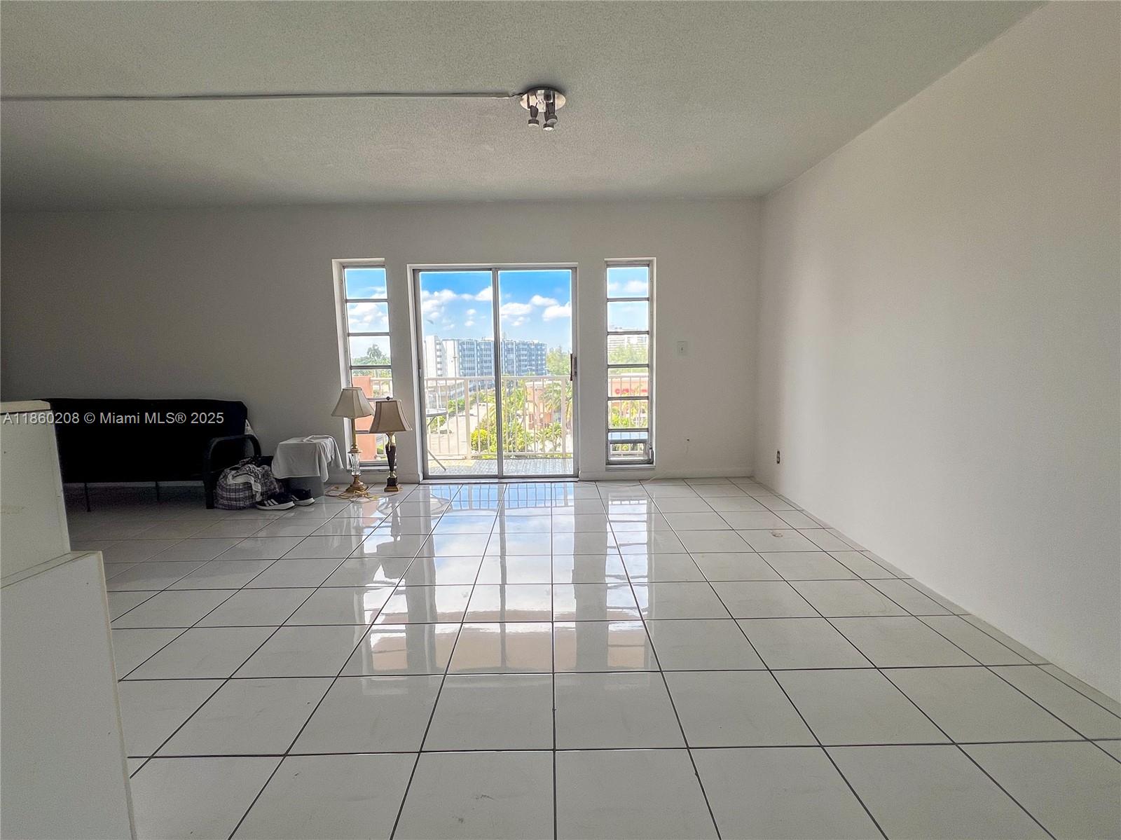 2200 East Hallandale Beach Boulevard, Unit 603 Hallandale Beach, FL 33009 - Photo 4 of 17 a view of an empty room with a window