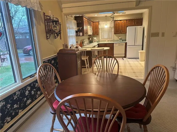 a view of a dining room with furniture window and outside view