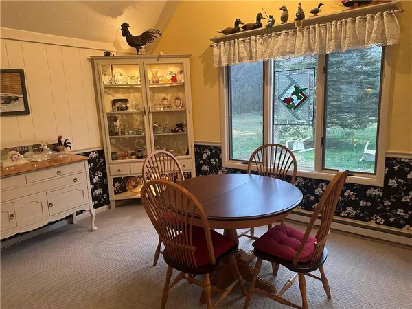 a dining room with furniture and window