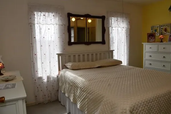 a white toilet sitting next to a shower curtain