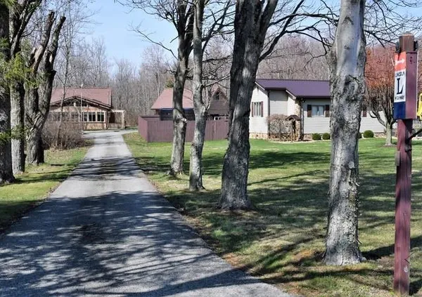 a view of a house with a yard